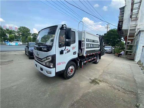 王總定購的東風(fēng)多利卡D6國六壓縮式垃圾車圖片